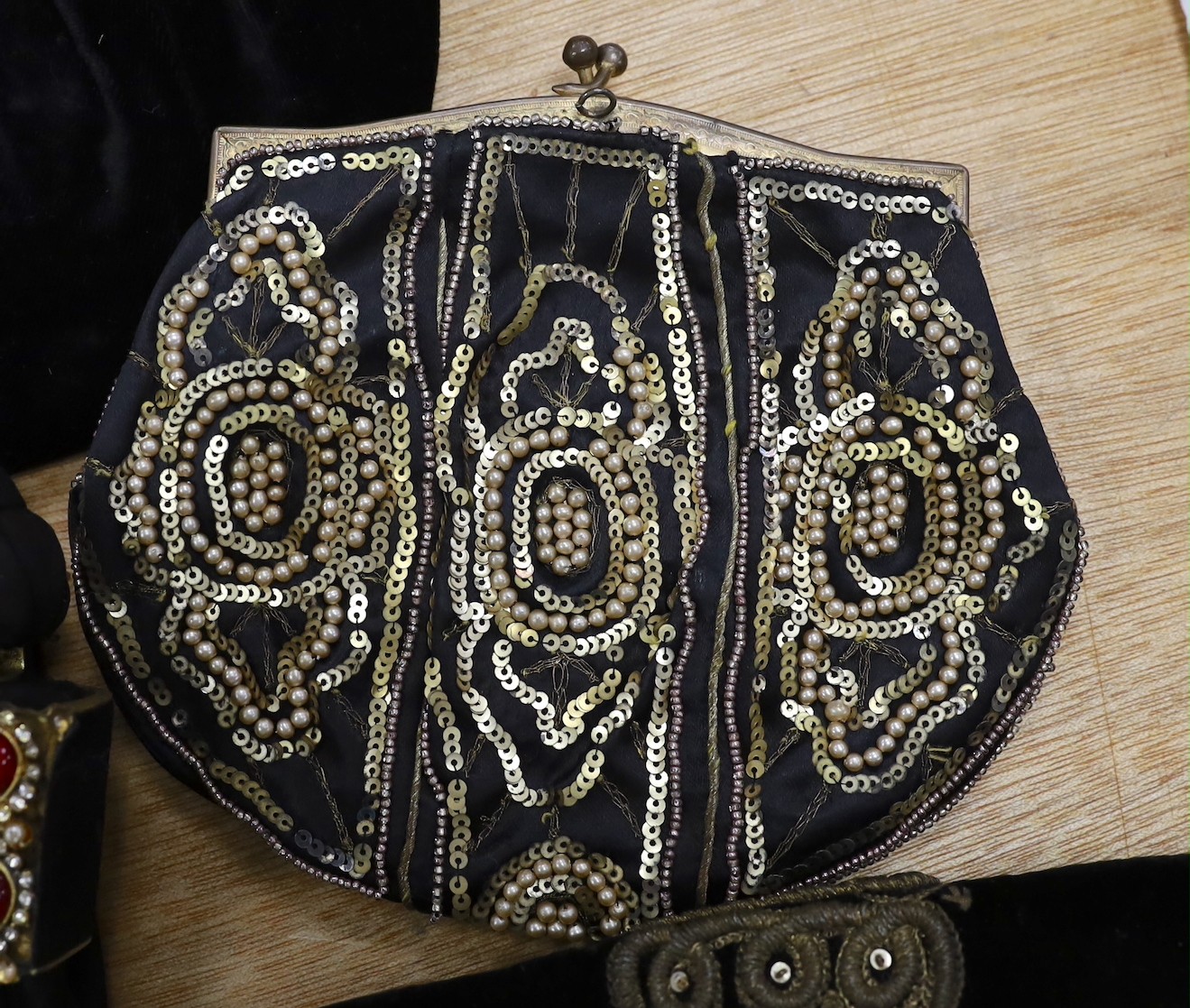 A 1930’s evening bag with silver frame, seven 1930’s-40’s evening bags with diamante encrusted Bakelite frames and clasps, a costume jewelled bag and two gilt and sequin bags